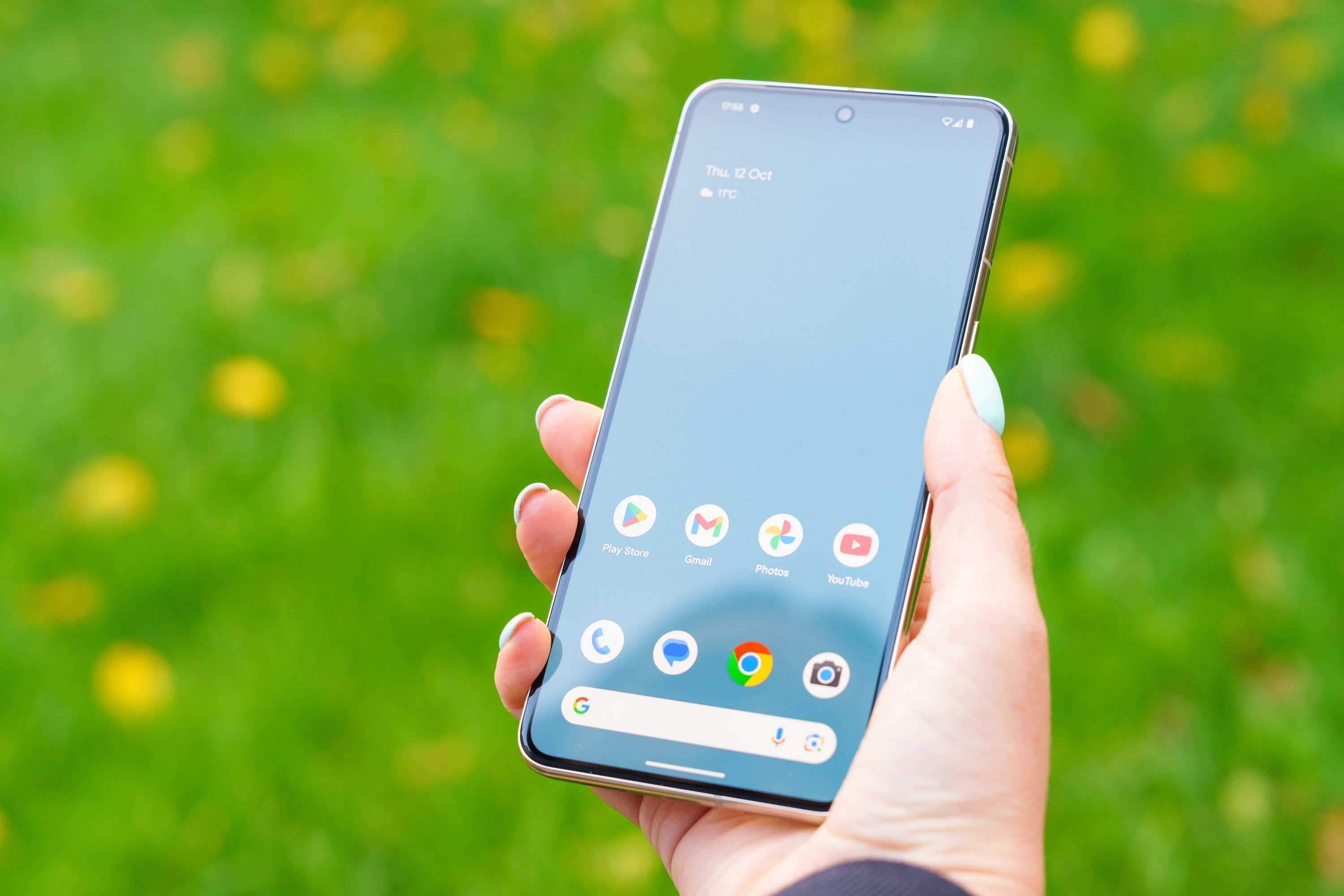 woman holding a pixel 10 phone