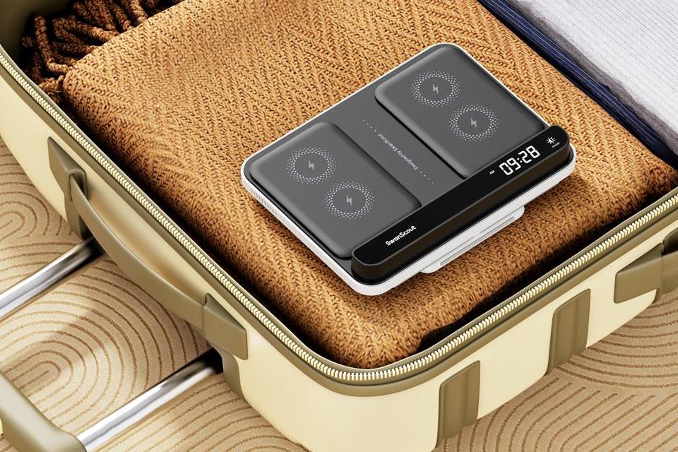 SwanScout portable multi-device charging station packed inside a travel suitcase.